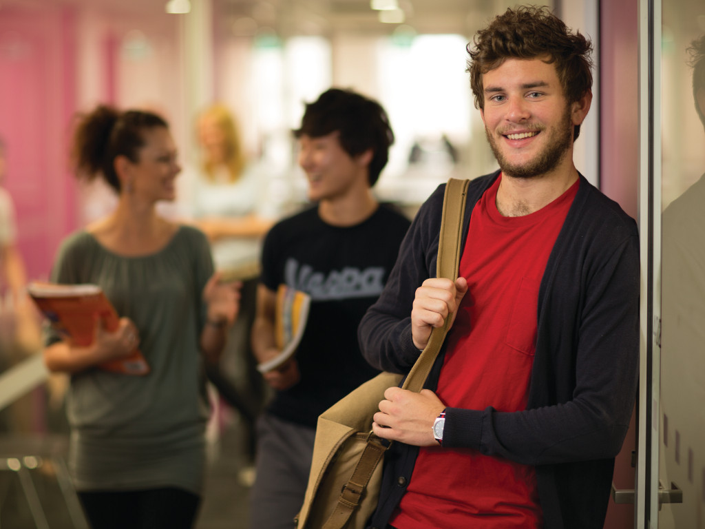 58b31d525b__2. Greenwich photo of student going out from class.jpg